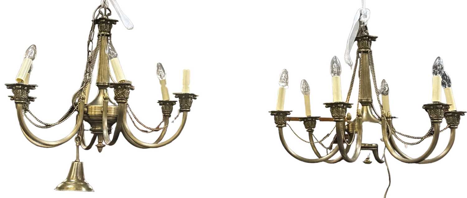 A pair of modern brass effect six branch chandeliers, height 55cm.