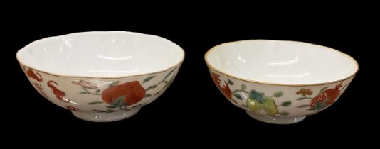 A pair of Chinese porcelain hand painted bowls decorated with fruit, marks to base, diameter 13.