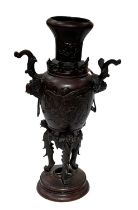 A Japanese bronze Meiji period vase decorated with a swooping bird, height 32cm.