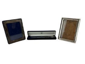 SAMUEL M LEVI; a George V hallmarked silver photograph frame, Birmingham 1918, 16 x 12cm, another