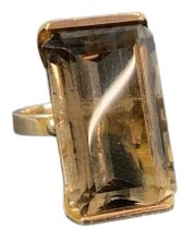 A yellow metal smoky quartz set ring, size Q, approx 18g.