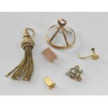 A quantity of 9ct gold and yellow metal items including a tassel pendant, clasps etc, combined