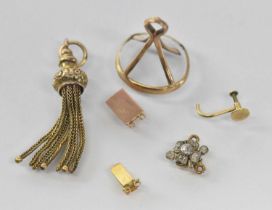 A quantity of 9ct gold and yellow metal items including a tassel pendant, clasps etc, combined