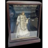 A 19th century mahogany cased wax figure of St Anthony of Padua, 40 x 29cm.