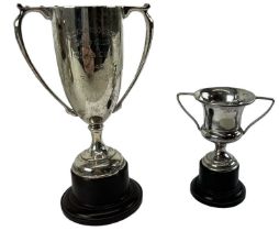 ROBERT PRINGLE & SONS; a miniature hallmarked silver trophy cup on base, London 1937, height