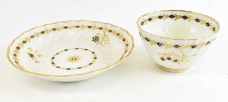 A first period Worcester gilt decorated saucer, diameter 14cm, and matching first period Worcester