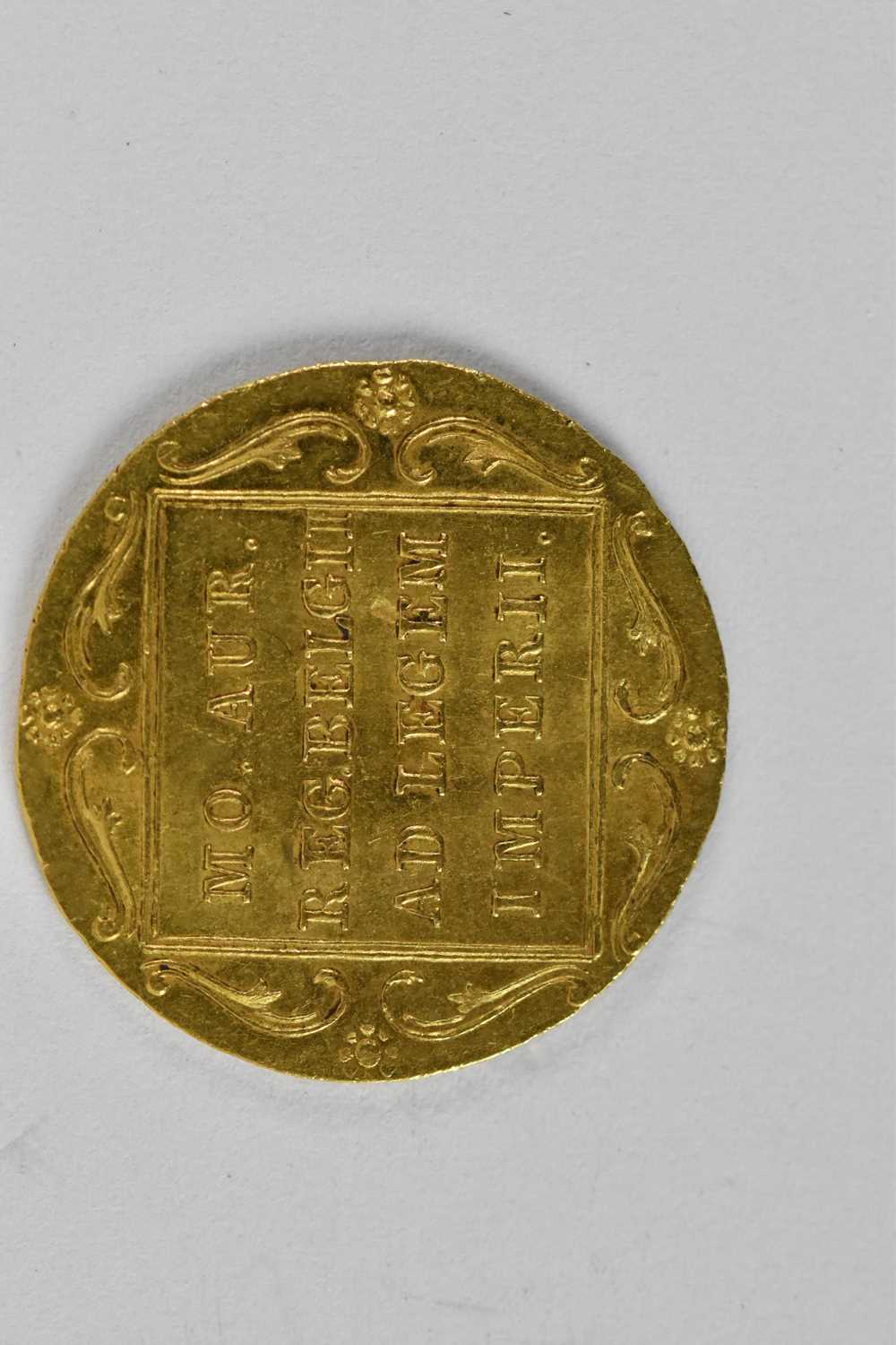A Dutch one dukat gold coin, 1831, diameter 2cm, approx 3.5g. - Image 2 of 2
