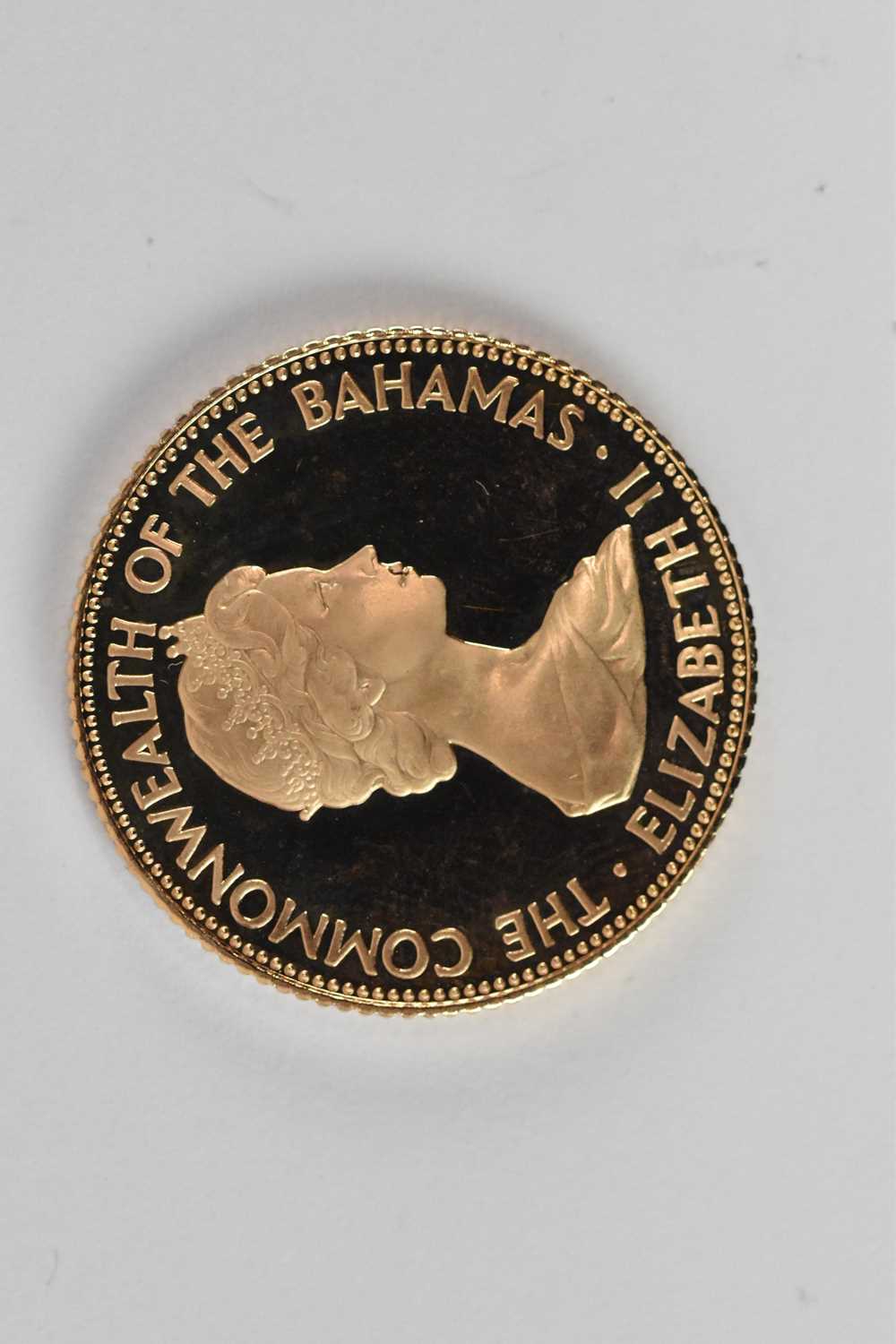 An Elizabeth II Commonwealth of The Bahamas 1973 Independence fifty dollar coin, diameter 2.8cm, - Image 2 of 2