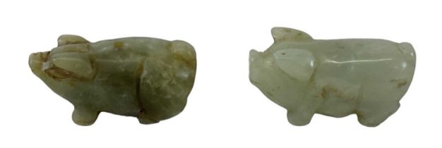 Two small Chinese jade figures of pigs, height 2.2cm, length 4.5cm (both with drill holes to the
