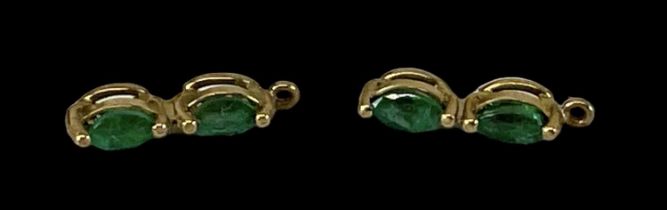 A pair of yellow metal emerald set earrings, combined approx 1g.