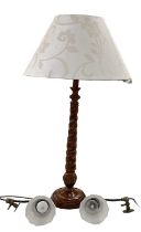 A modern walnut effect barley twist column table lamp, height to top of fitment 63cm, and two modern