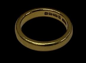 A 22ct yellow gold wedding band, size I, approx 5.8g.