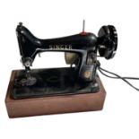 A Singer 99K sewing machine with cover.