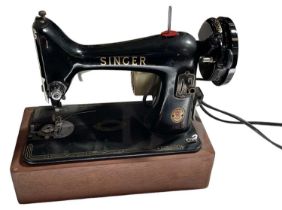 A Singer 99K sewing machine with cover.