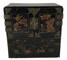 An 20th century Japanese lacquered collector's cabinet, with two drawers enclosing six drawers (