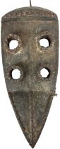A Dan Gagon headdress/mask with four eyes and hinged jaw, with studded decoration, height 46cm,