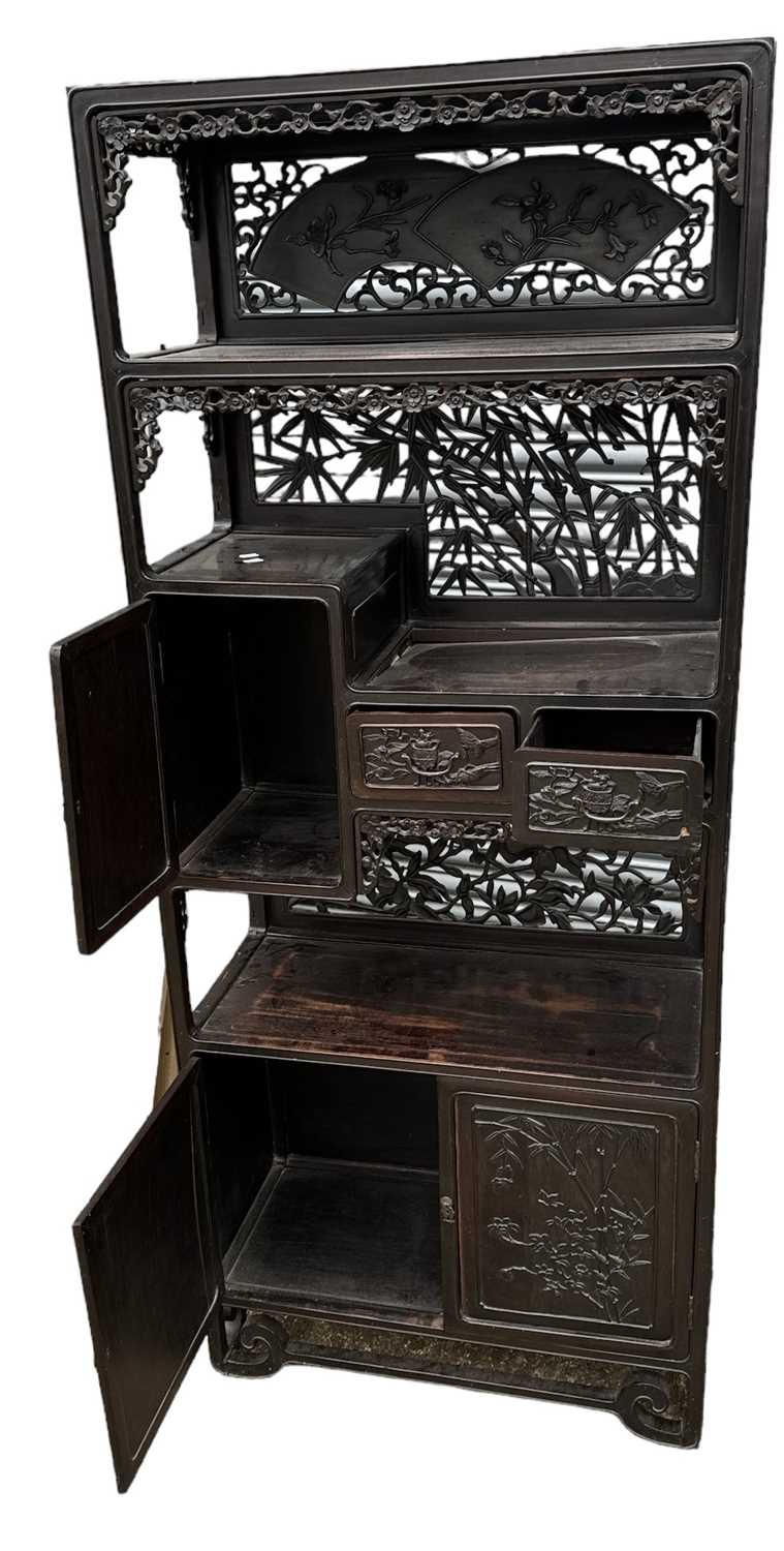A Chinese carved hardwood and ebonised display cabinet, with two drawers above pair of cupboard - Image 2 of 2