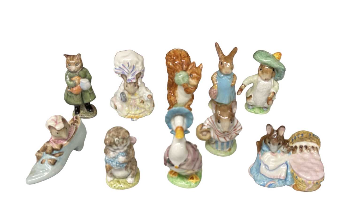 BESWICK; a group of ten Beatrix Potter figures including 'Hunca Munca', 'Mrs Tittlemouse', 'Jemima