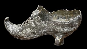 An elaborate late Victorian hallmarked silver pin cushion modelled as a shoe, London 1896, height