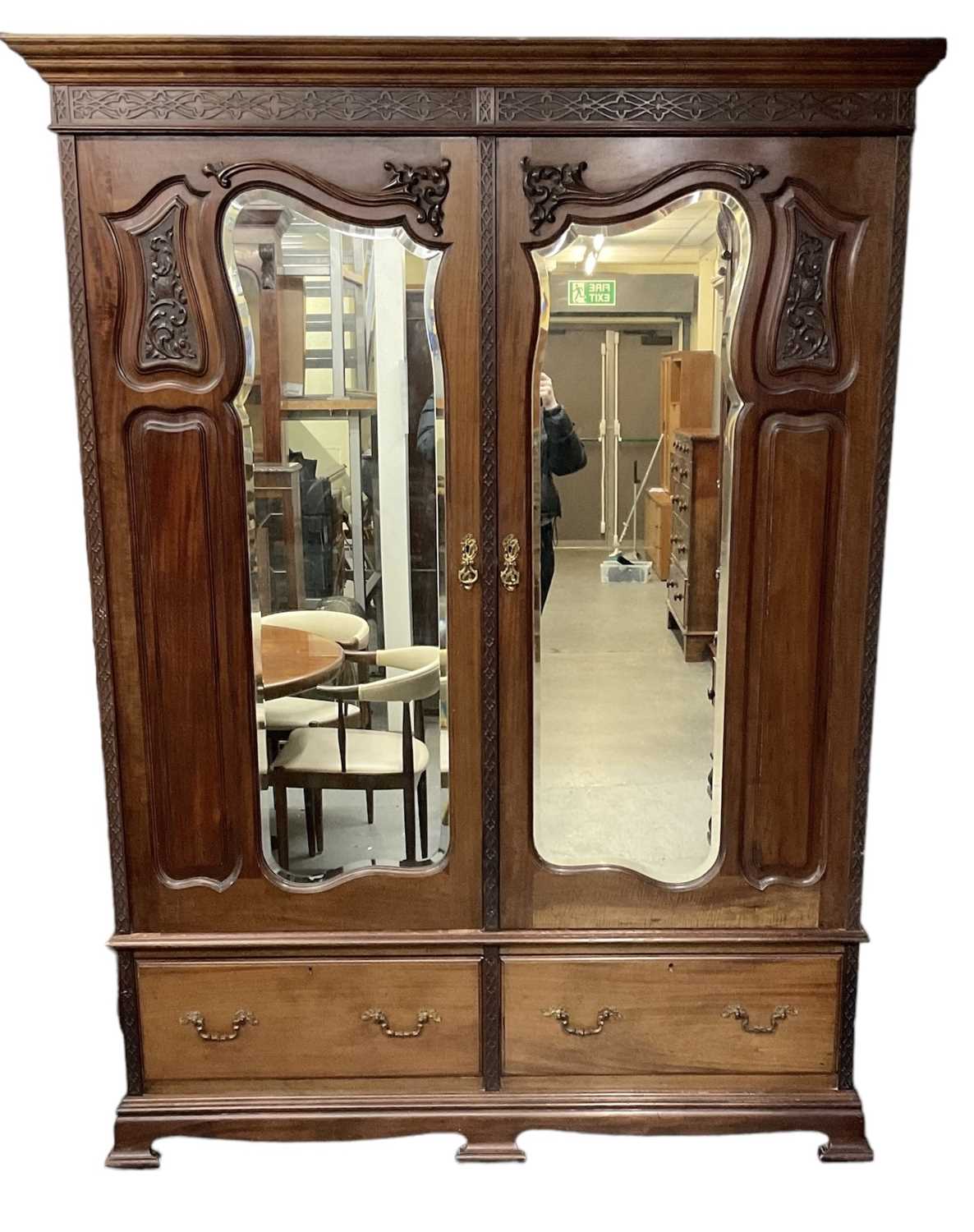 An early 20th century mahogany wardrobe, with pair of mirrored doors above pair of drawers, height