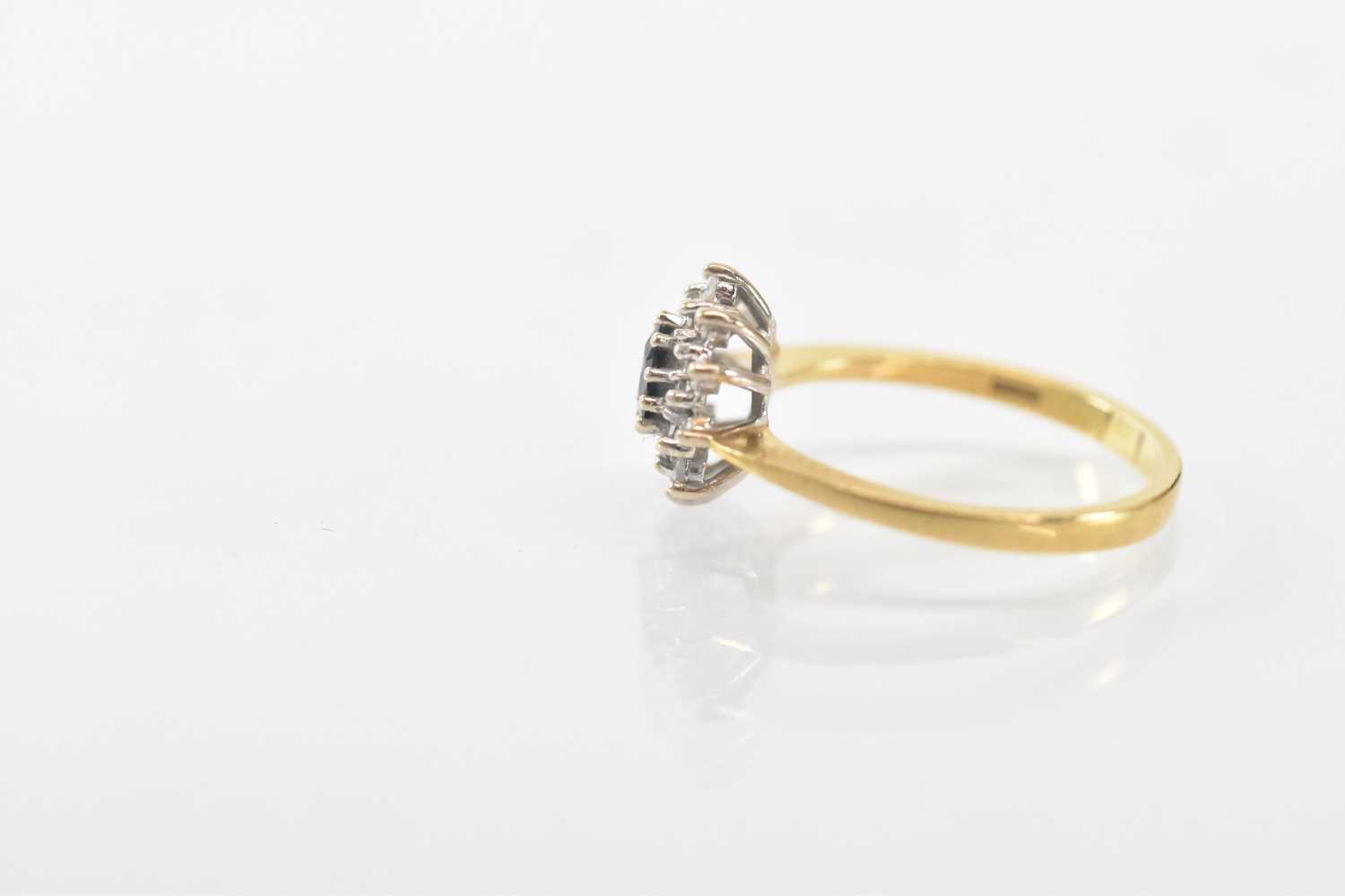 An 18ct yellow gold sapphire and diamond set cluster ring, the central heart shaped sapphire - Image 2 of 3