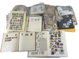 A large quantity of all world and GB stamps contained in albums, loose and on paper.