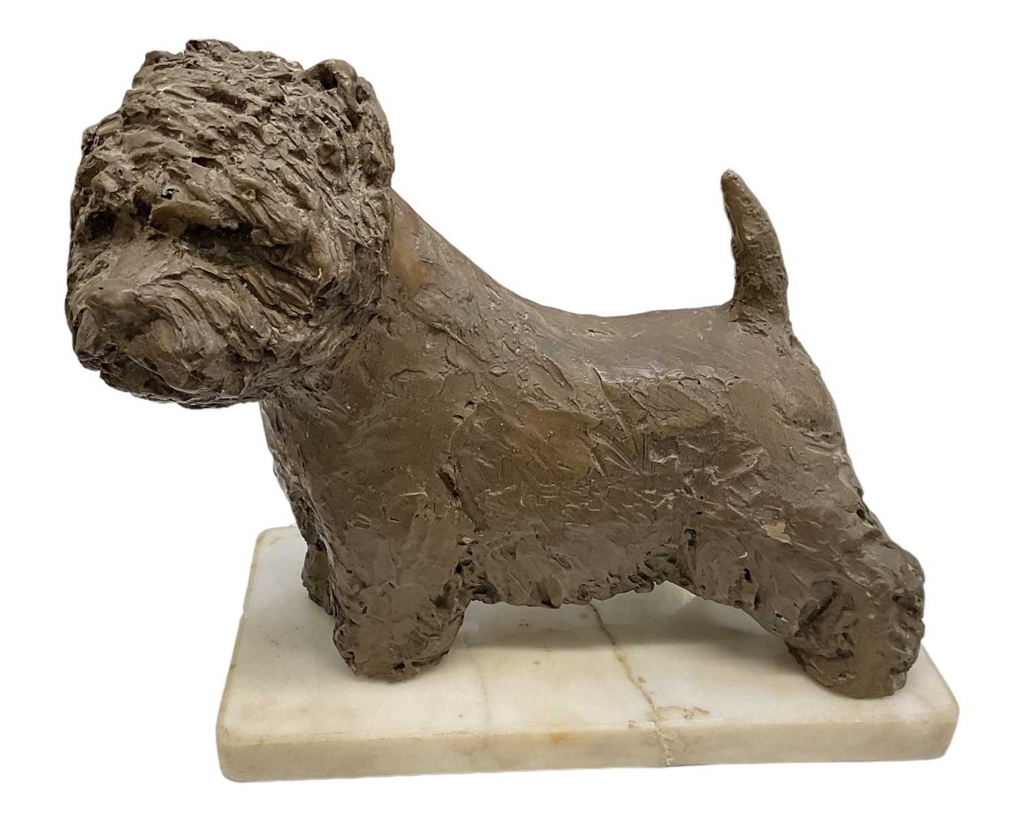 A bronze model of the Supreme Champion at Crufts dog "Olac moon pilot", on white marble base, height