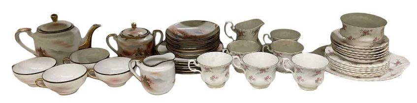 A Japanese part tea service comprising teapot, four teacups, lidded sugar bowl, milk jug, five