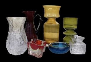A group of seven pieces of art glass including amber coloured vase, height 28cm, sage green vase,