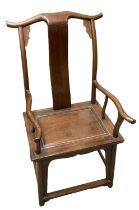 A large Chinese hardwood yoke back elbow chair, height 117cm.
