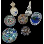 A group of three Murano glass paperweights, a Strathern paperweight, a Bohemian glass candlestick (