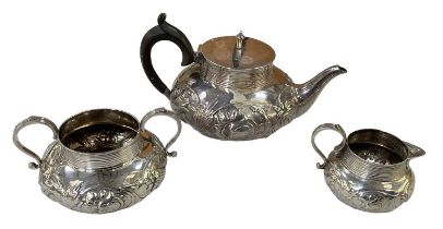 CF HANCOCK & CO; an Edward VII hallmarked silver teapot with floral decoration, London 1904, an