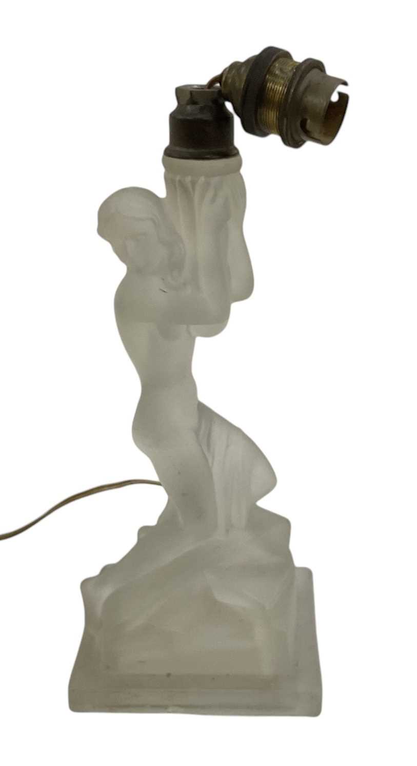 An Art Deco frosted glass figural table lamp in the form of a draped nude female, height to top of