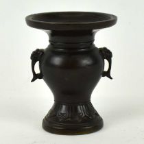 A small 19th century Chinese bronze vase with calligraphy mark to base, height 8.5cm.