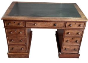 A Victorian mahogany pedestal desk with black leather insert top, width 122cm.