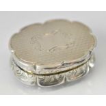 ROBERT THORNTON; a Victorian hallmarked silver shaped oval vinaigrette with gilt interior,