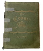 A Crown stamp album containing a small quantity of all world stamps.