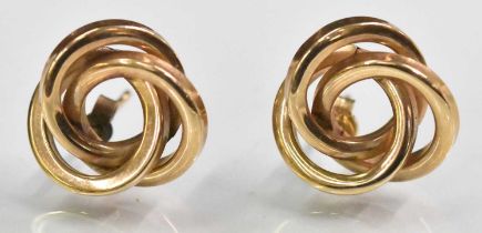 A pair of 9ct yellow gold swirl effect earrings, combined approx 2.8g.