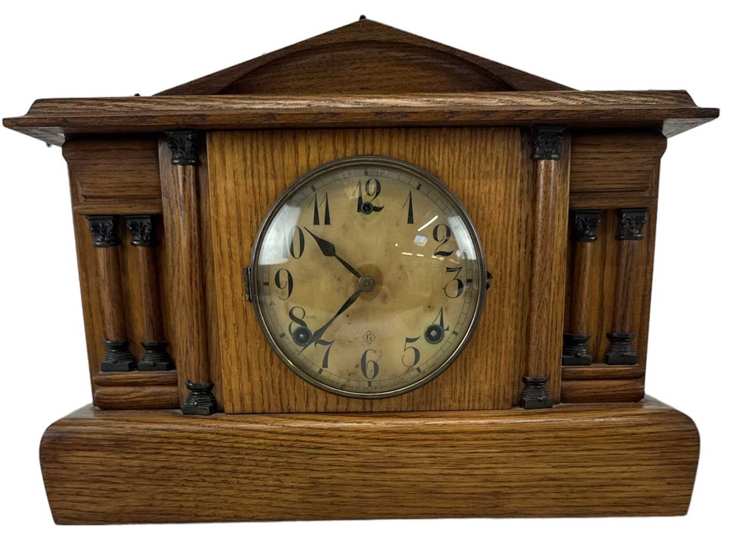 WM L GILBERT CLOCK CO; an early 20th century oak cased mantel clock, height 30cm, width 40cm.