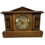 WM L GILBERT CLOCK CO; an early 20th century oak cased mantel clock, height 30cm, width 40cm.