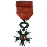 A French Legion of Honour white and green enamelled medal dated 1870, inscribed 'République