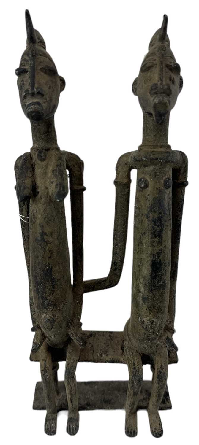 A Benin type bronze model of a seated couple, height 26cm.