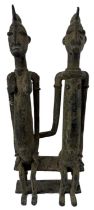 A Benin type bronze model of a seated couple, height 26cm.
