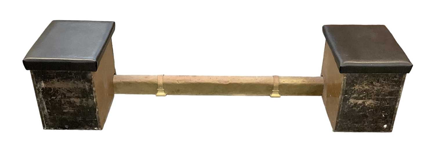 A brass clad fire surround, each end with a leather topped box with hinged lid, overall width