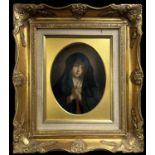 A 19th century Italian oval oil on board, 'Madonna in Prayer', inscribed and dated 1882 verso, 21