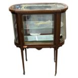 An Edwardian mahogany and inlaid oval display cabinet/bijouterie table, width 69cm, depth 39cm,