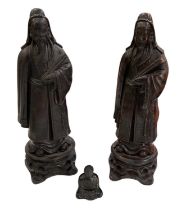 A pair of Chinese carved hardwood figures of a gentleman, height 30cm, and a miniature model of