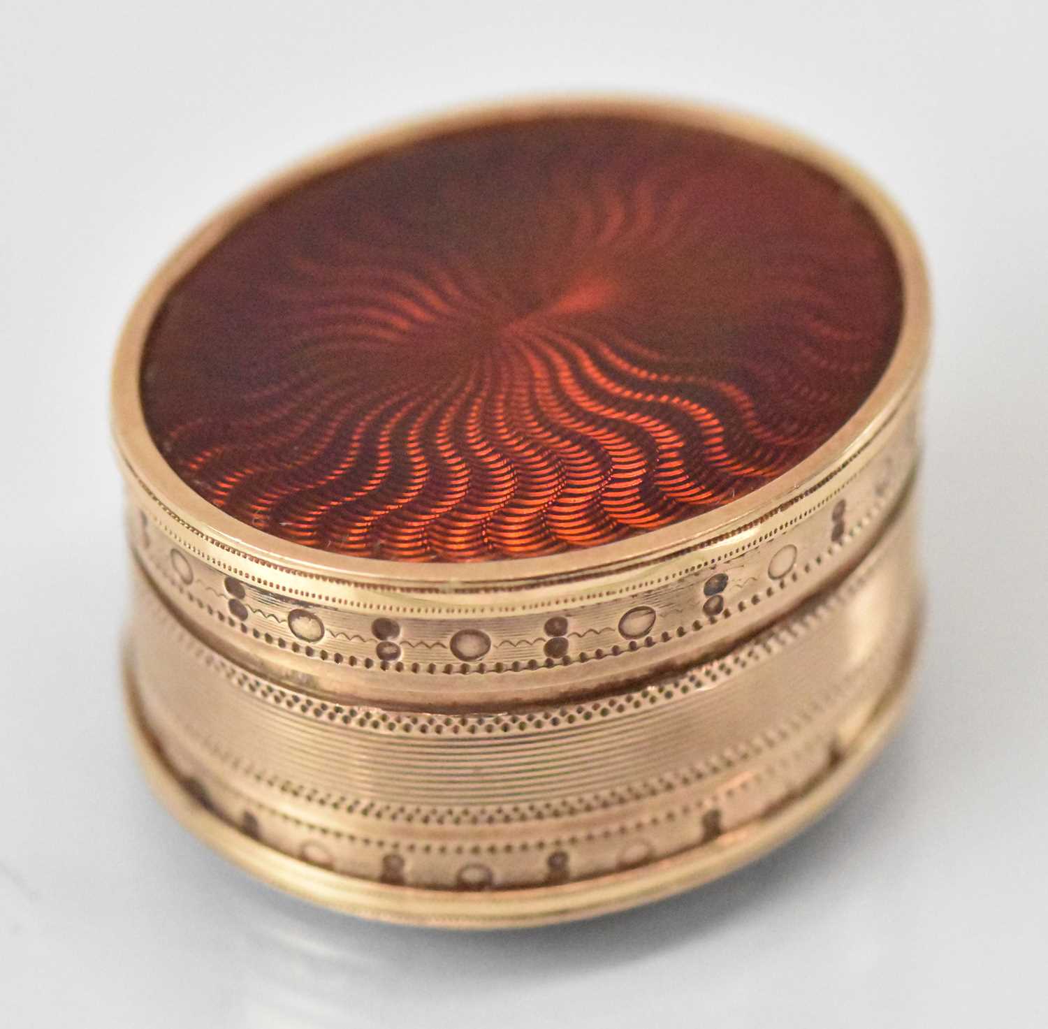 A fine 19th century rose gold and red enamel vinaigrette of oval form, 3 x 2.8cm, approx 19.2g.