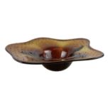 An amber coloured art glass bowl, diameter 37cm.