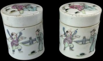 A pair of late 19th century Chinese porcelain lidded jars decorated with figures, height 7cm,